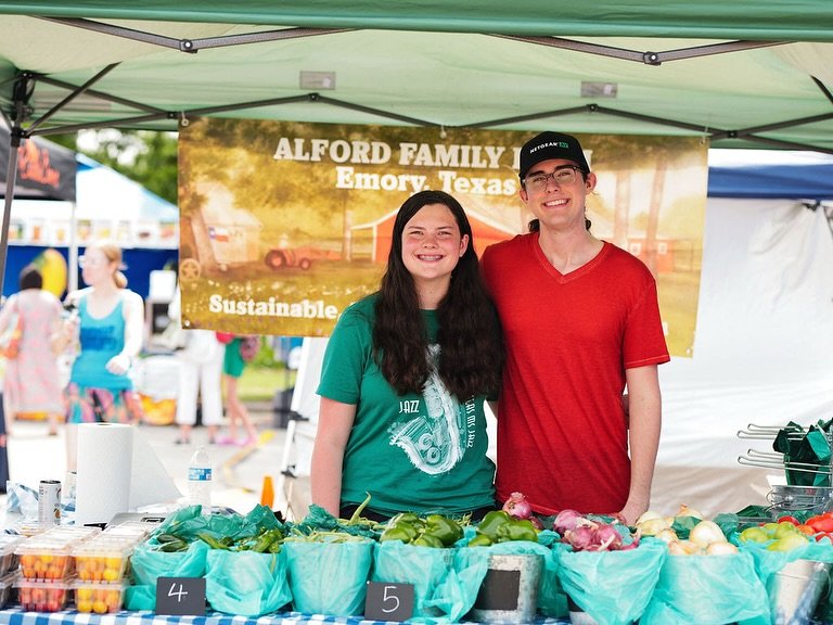 Stylish farmers and friends share a laugh before market open