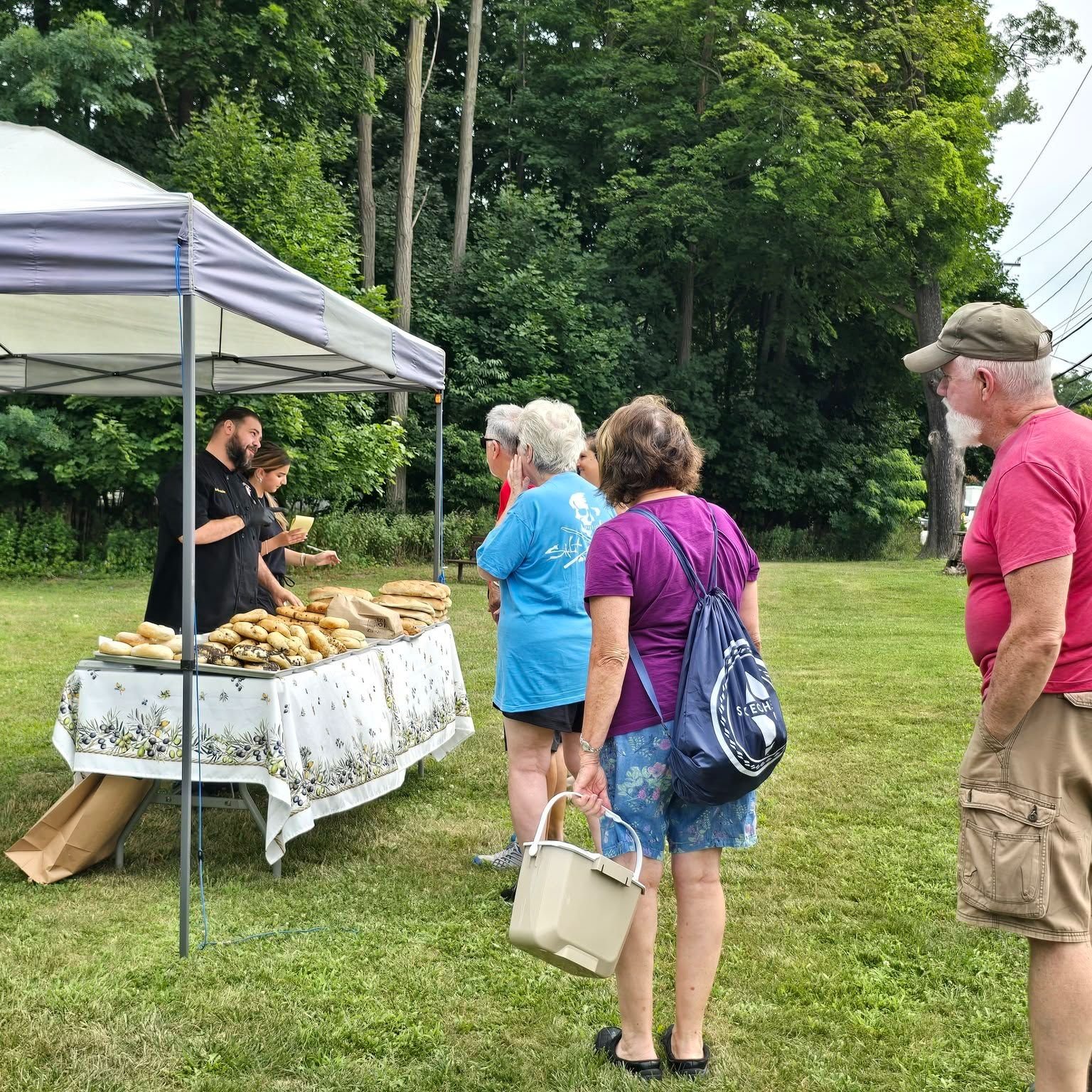 Shoppers browse baked goods at Lakeside Farmers Market